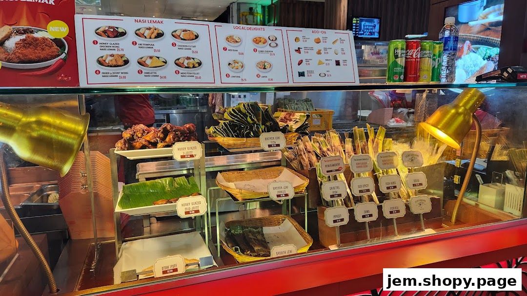 A display of Nasi Lemak and other local delights with prices and descriptions.