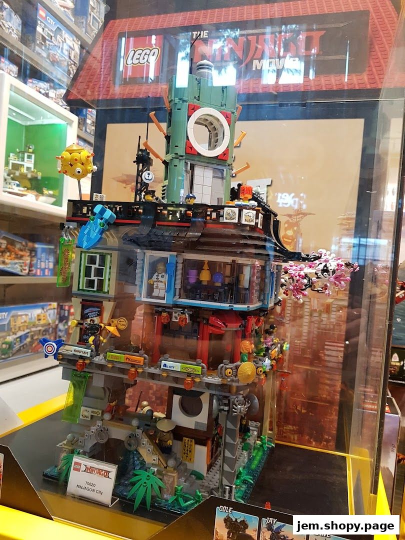 A detailed LEGO Ninjago City set displayed in a store window.