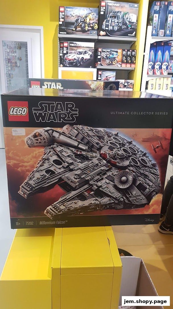 A large LEGO Star Wars Millennium Falcon Ultimate Collector Series set is displayed.