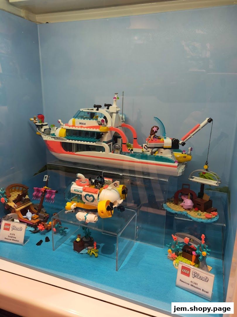 Display of LEGO Friends rescue-themed building sets in a shop window.