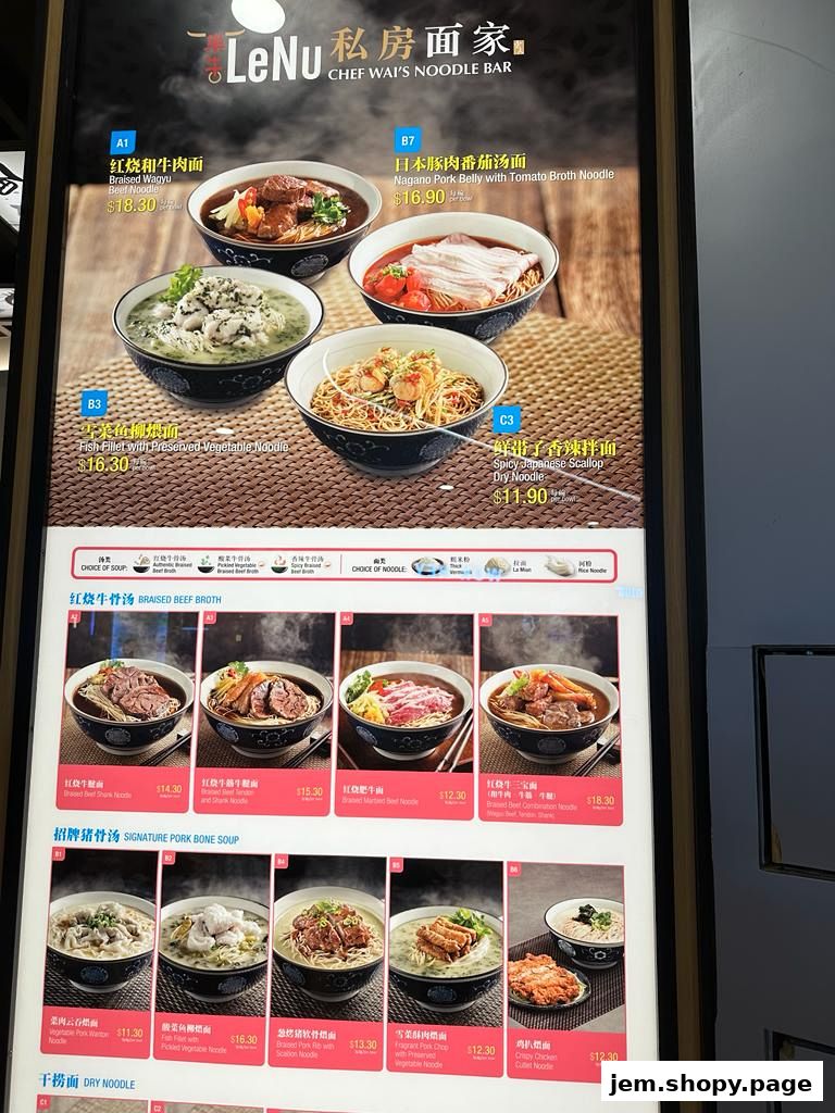 A menu board displaying various noodle dishes with prices and images.