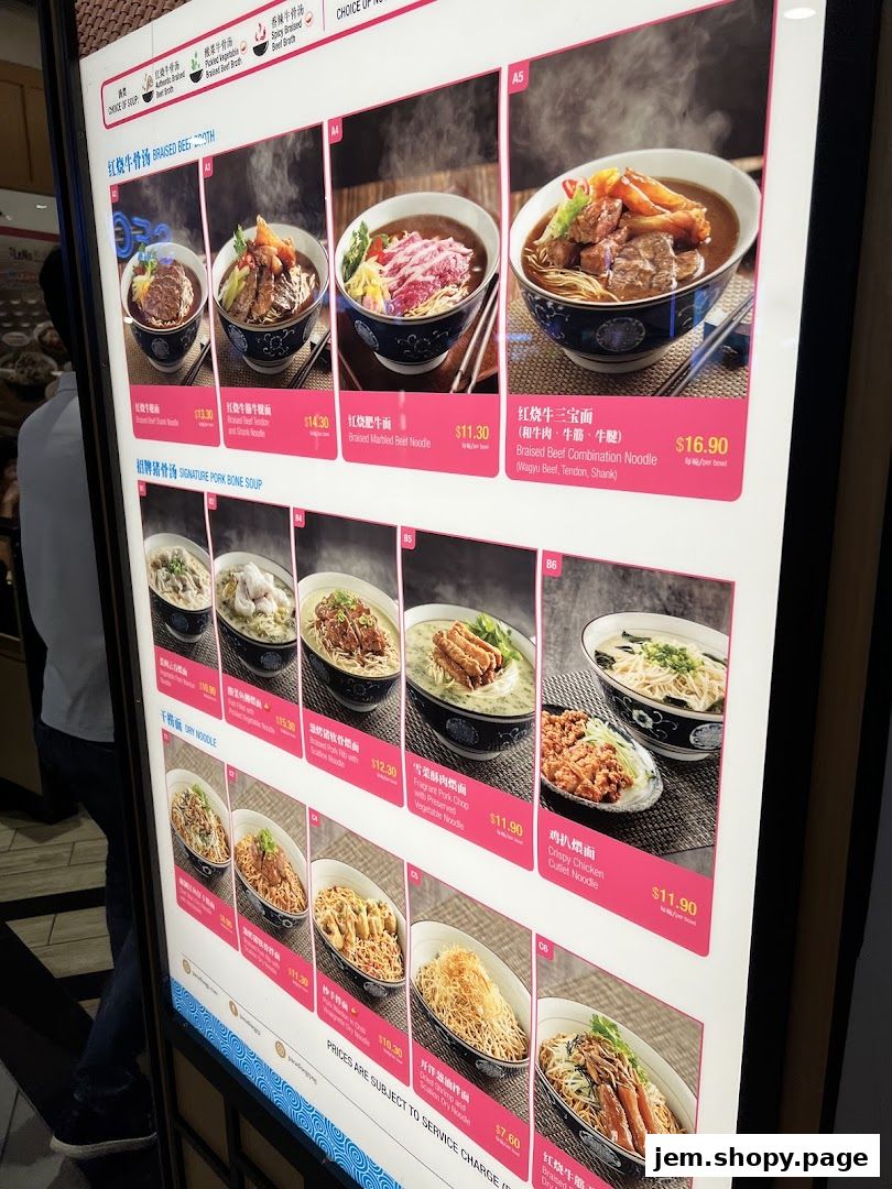A digital menu board displaying various noodle dishes with appetizing images and prices.