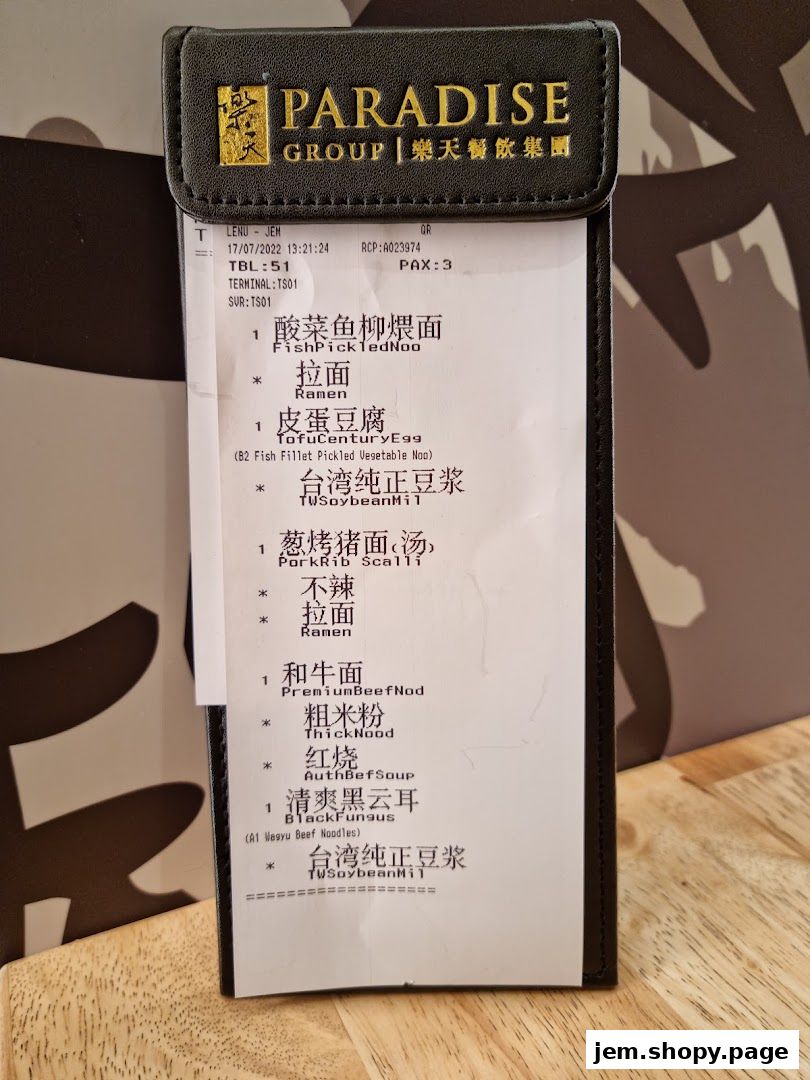 A receipt from LeNu Chefs Wai Noodle Bar showing various noodle dishes and side orders.