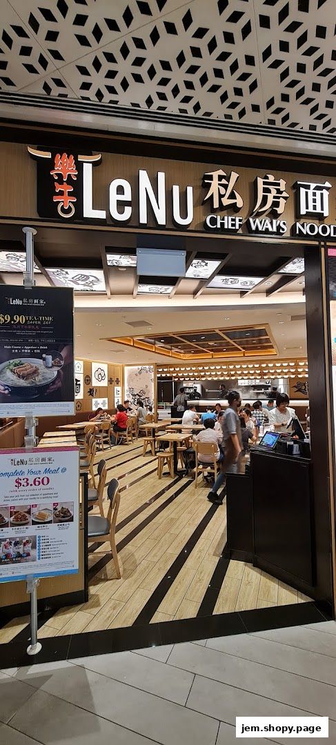 The entrance of LeNu Chef Wai's Noodle Bar with seating and a promotional poster.