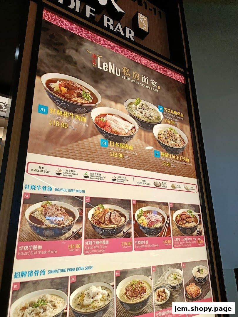 A menu board displaying various noodle dishes with appetizing images and prices.
