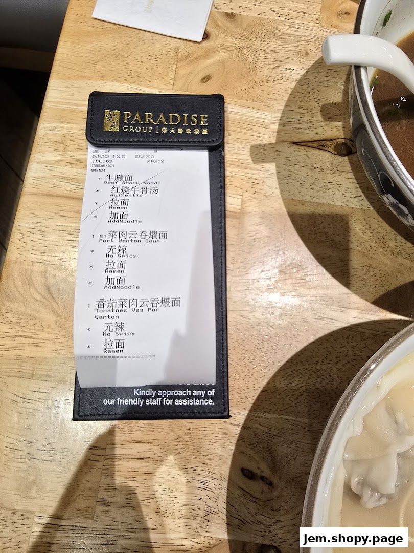 A receipt from LeNu Chefs Wai Noodle Bar showing noodle dishes and add-on options.