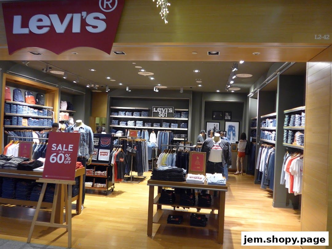 Interior view of a Levi's store showcasing denim products and apparel with a sale sign.