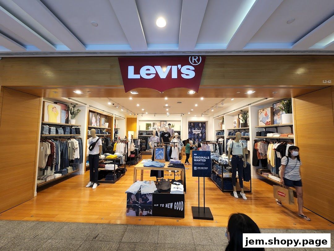 The entrance of a Levi's store displaying jeans, t-shirts, and mannequins.