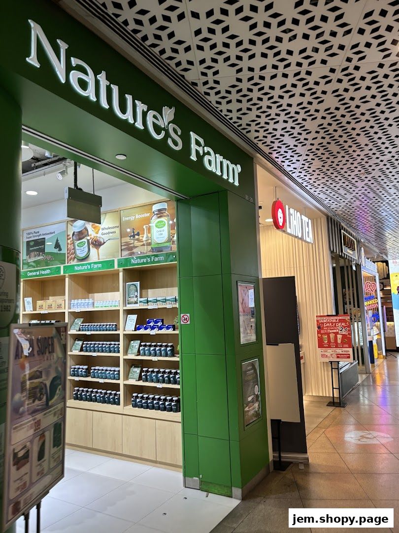 Exterior view of Nature's Farm and LiHO TEA shops in a mall.