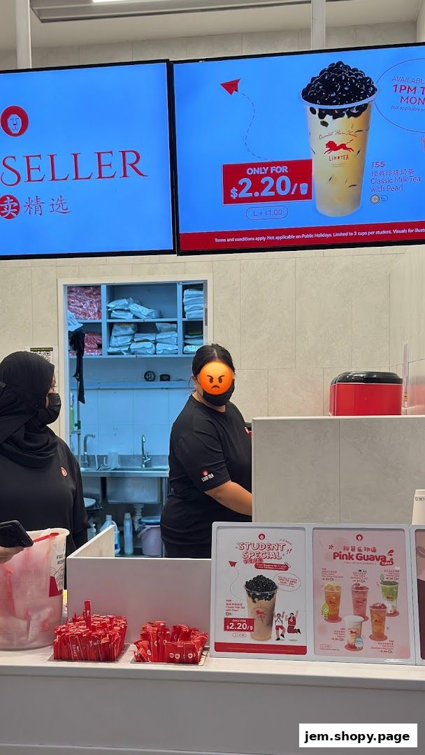 LiHO TEA shop counter with staff, promotional displays, and bubble tea.