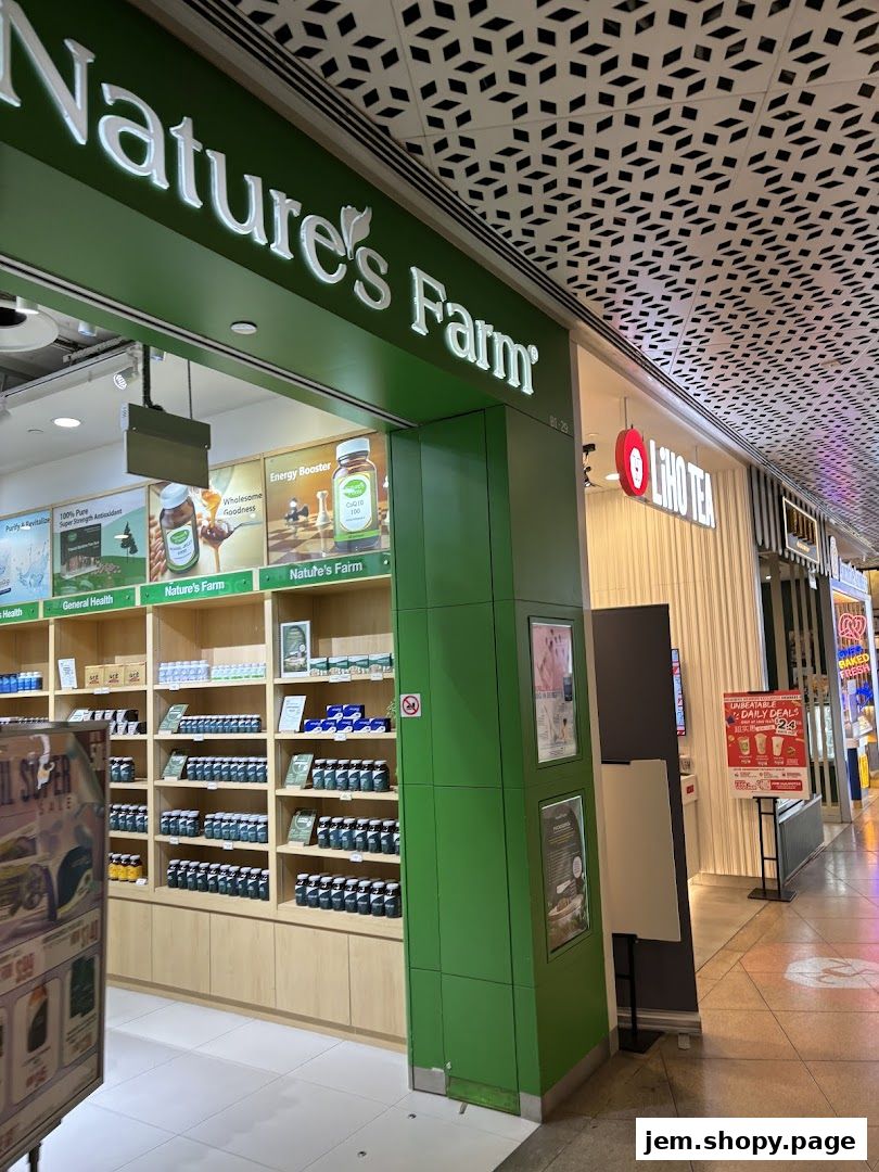 The exterior of Nature's Farm and LiHO TEA shops in a mall.