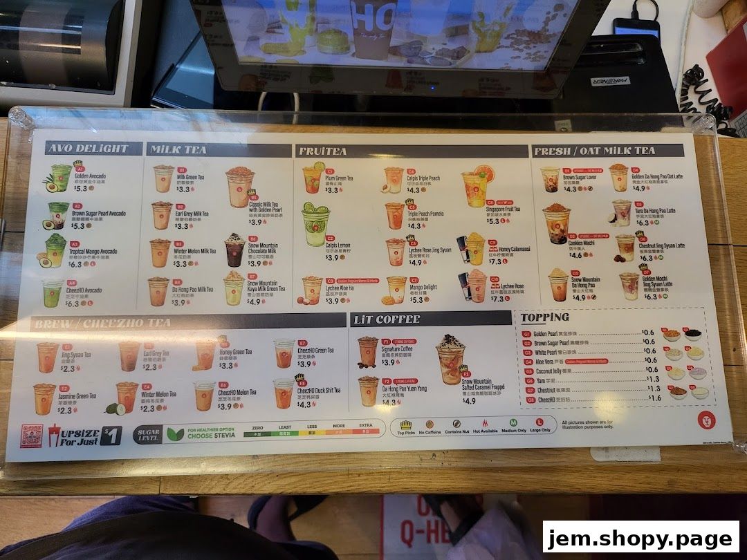 A menu board displaying various milk teas, fruit teas, coffee, and toppings with prices.