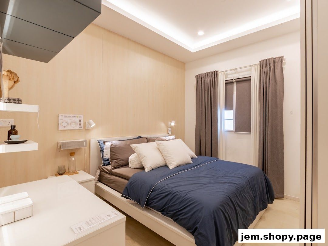 A beautifully designed bedroom with a comfortable bed, bedside table, and window with curtains.