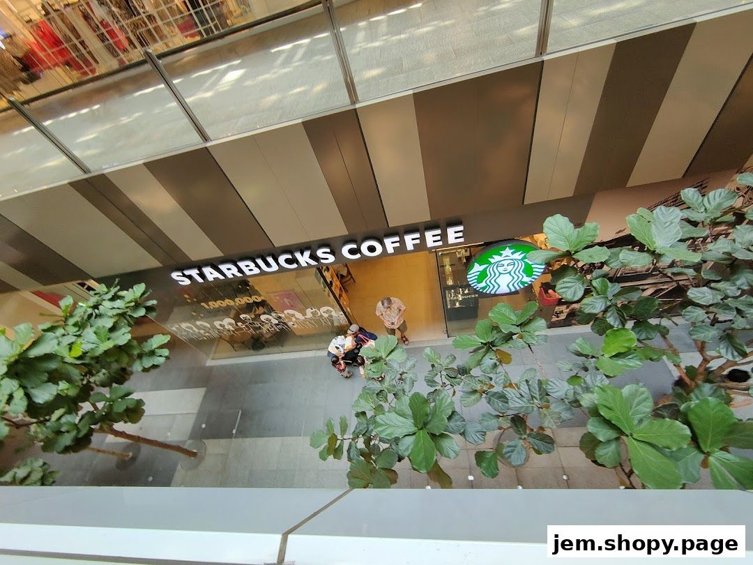 Exterior view of a Starbucks Coffee shop with its iconic logo and signage.