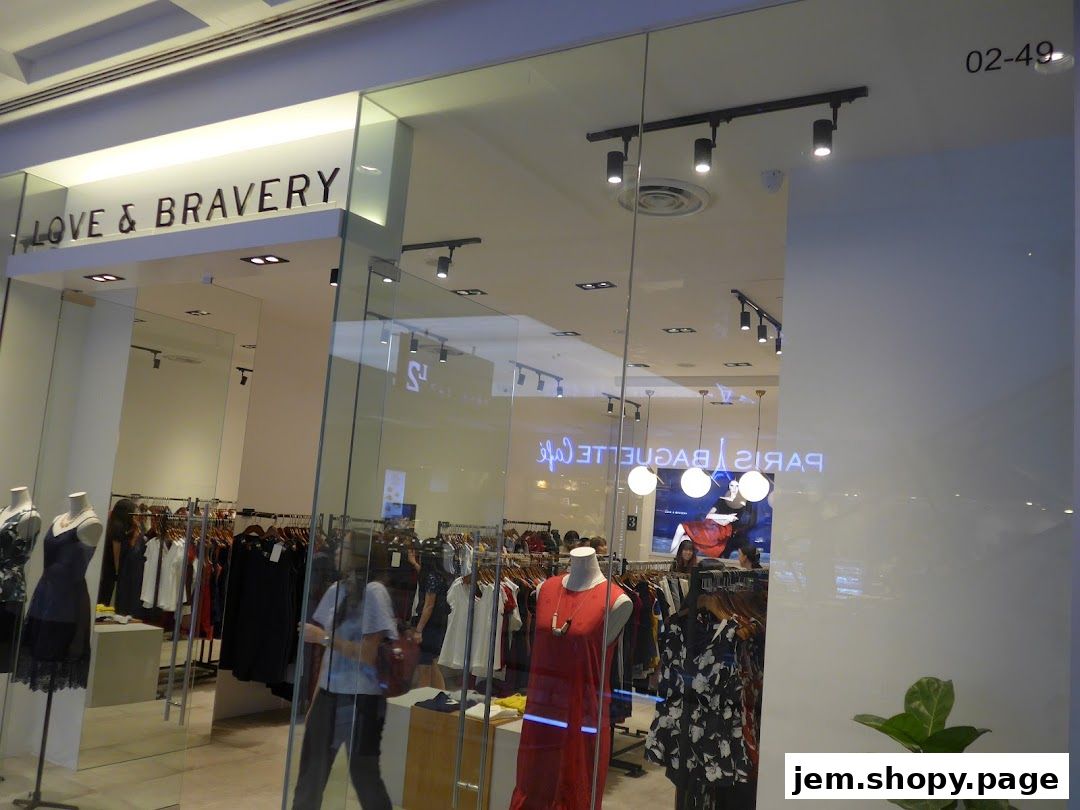 The entrance of a clothing store named Love and Bravery, showcasing dresses and apparel.