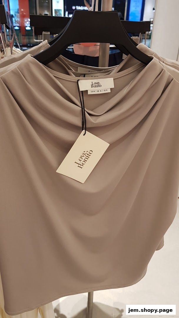 A beige draped top from Love, Bonito with a size tag and brand tag.