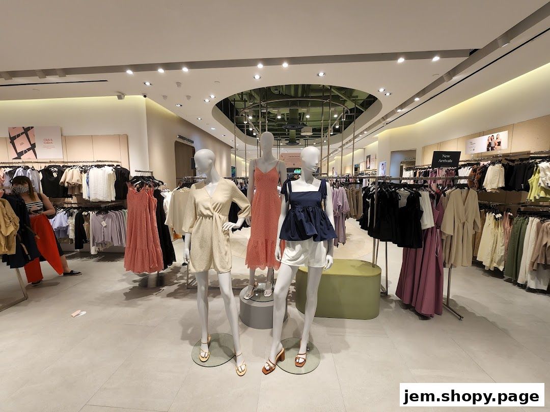 Interior view of a women's fashion store with mannequins and clothing racks.