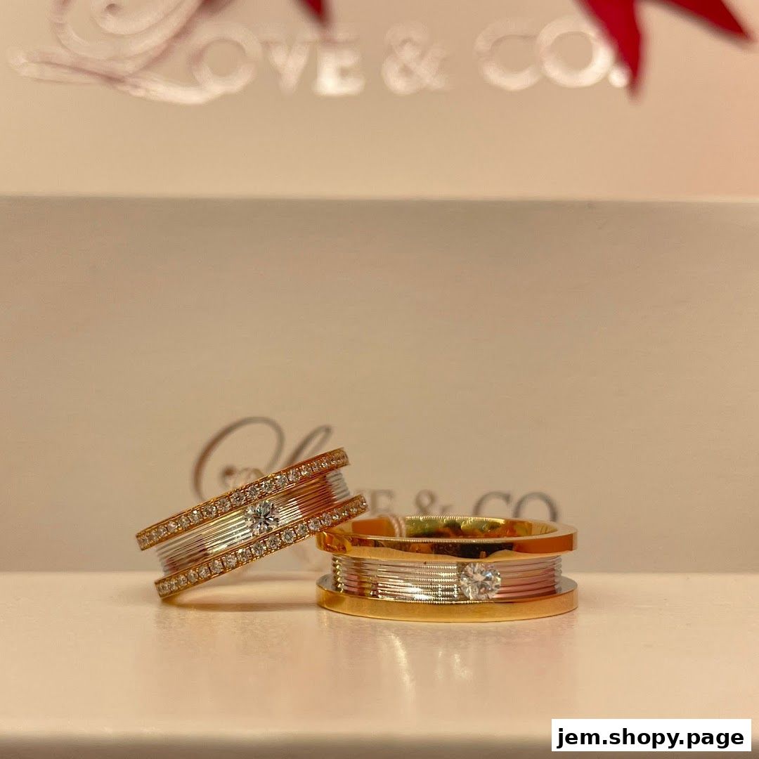 Two elegant diamond rings, one tilted, with the shop's logo in the background.