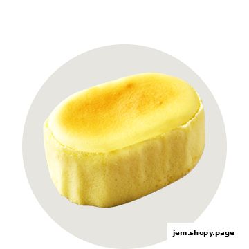 A golden-brown, oval-shaped baked cheesecake with a soft, fluffy texture.