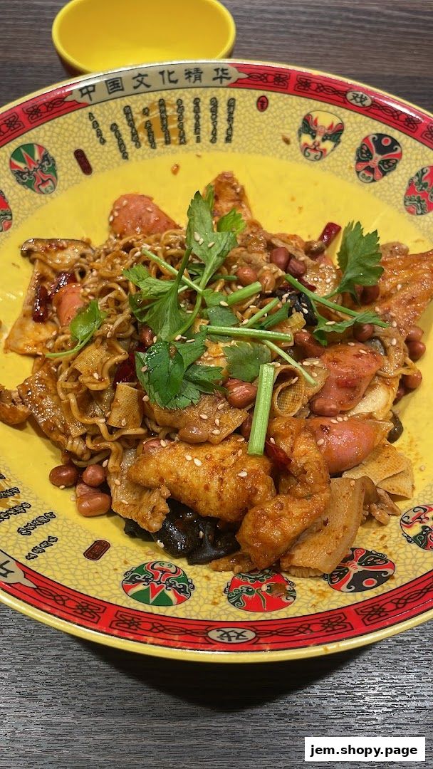 A close-up of a flavorful mala dish with noodles, sausages, peanuts, and tofu skin.