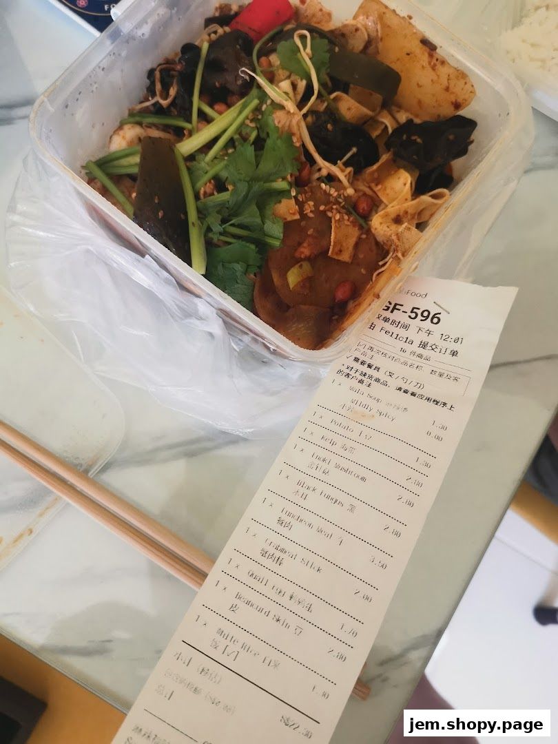 A receipt from Mala Version 2 showing a variety of spicy dishes and rice.