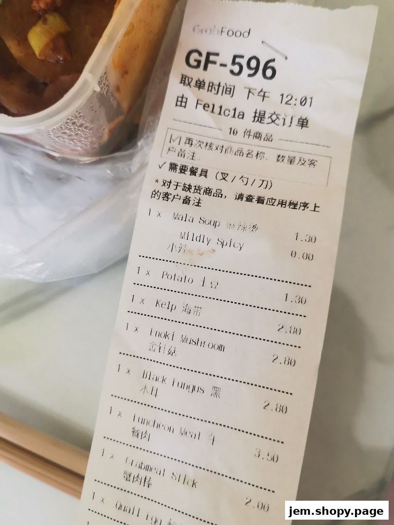 A receipt from GrabFood showing a Mala Version 2 order with various ingredients and prices.