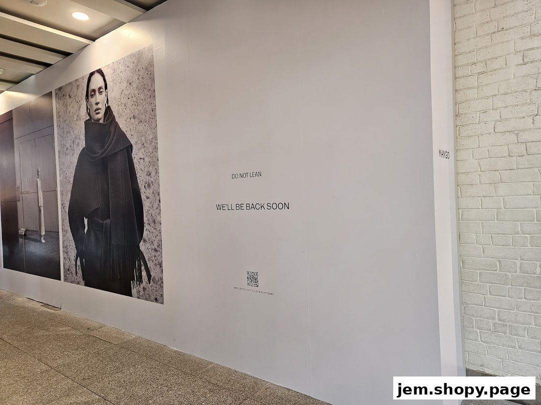 MANGO store under renovation with a 'We'll Be Back Soon' message and fashion imagery.