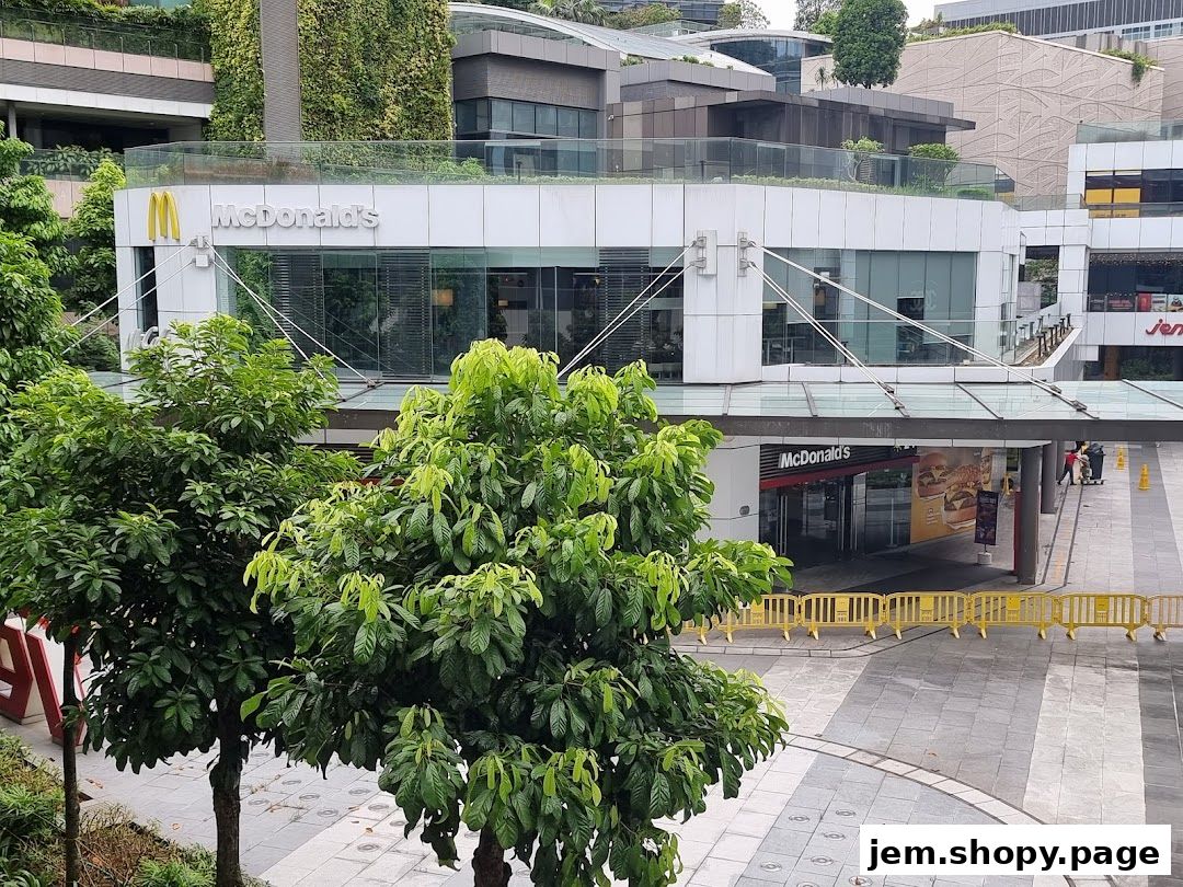 Exterior view of a McDonald's restaurant with its iconic golden arches and signage.