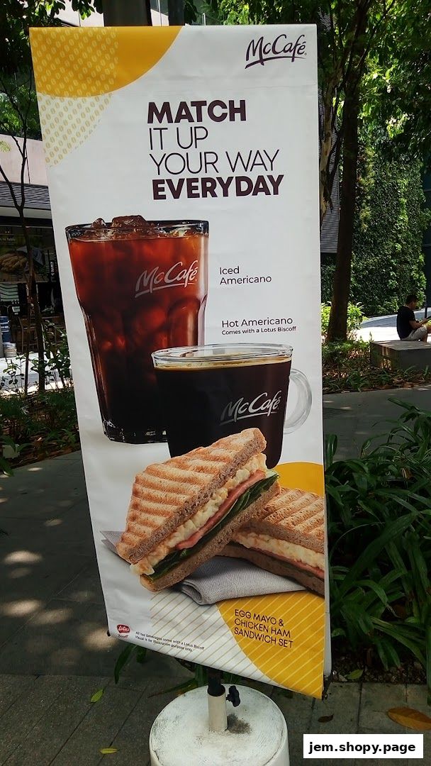 A McCafe banner advertising coffee and sandwich sets.