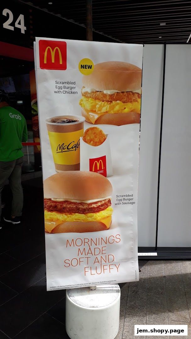 McDonald's advertisement featuring breakfast burgers, McCafe coffee, and hash browns.
