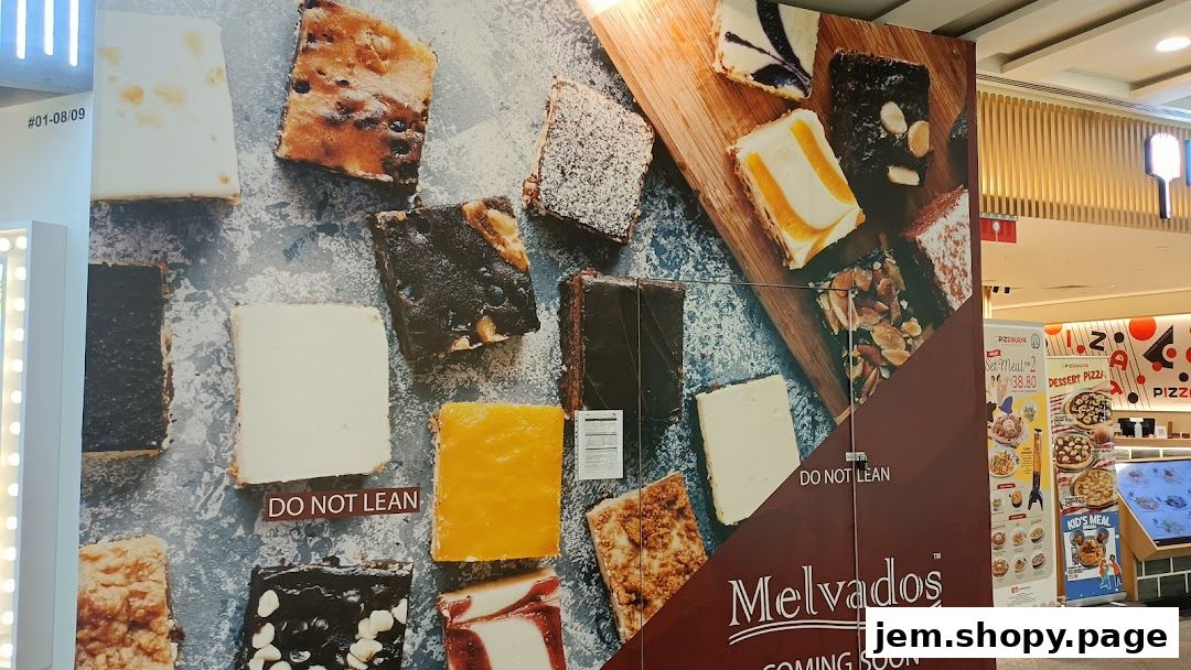 A large display showcasing various desserts and the Melvados brand.