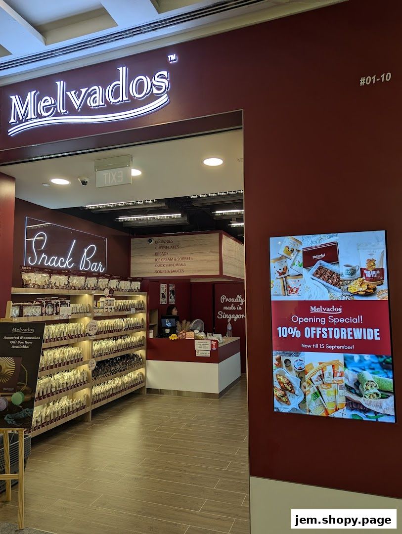 The Melvados snack bar shop front with shelves stocked with products and an opening special offer displayed.