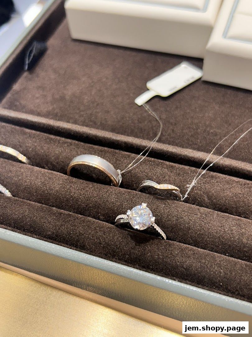 Close-up view of diamond rings displayed in a jewelry store display case.