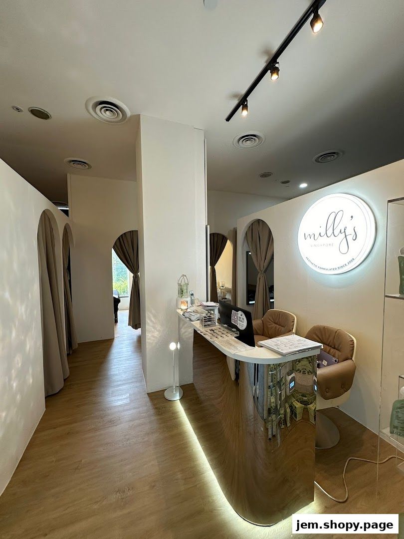 Interior view of Milly's Singapore aesthetic clinic reception area with a sleek counter.