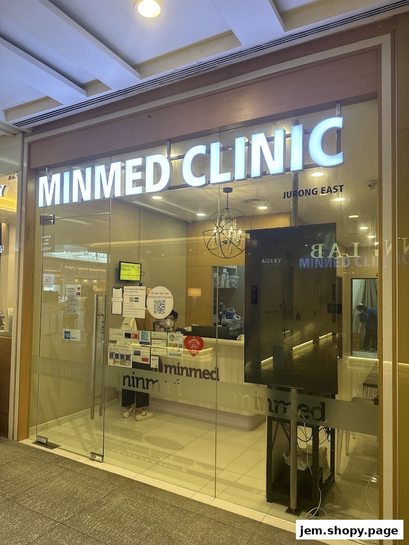 The exterior of Minmed Clinic Jurong East, a medical clinic with a glass storefront.