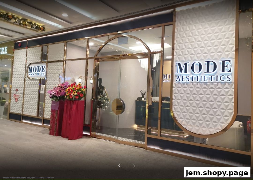 The exterior of MODE Aesthetics, a medical clinic, with floral arrangements and elegant signage.