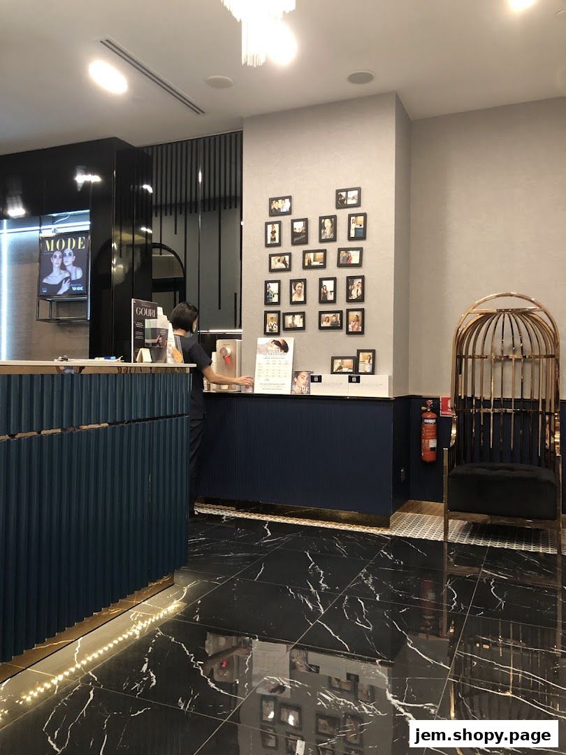 Interior of MODE Aesthetics with a reception desk, decorative photos, and a unique chair.