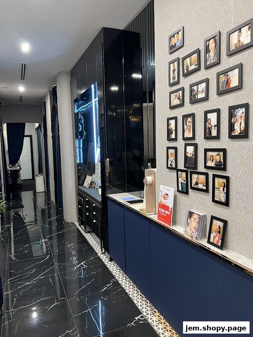 Interior view of MODE Aesthetics with framed photos and a sleek counter.