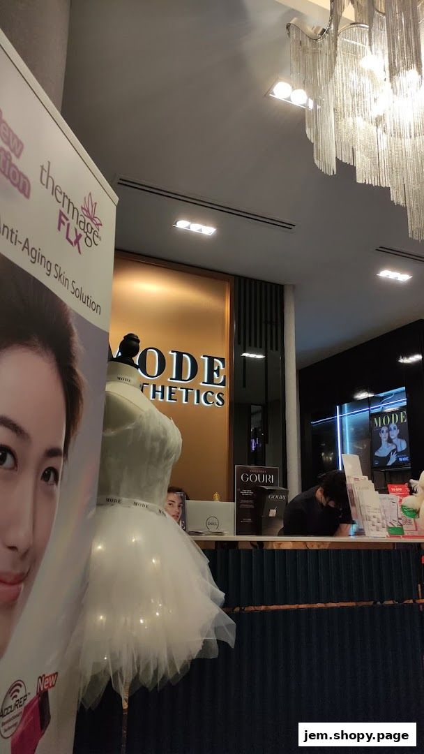 The entrance of MODE Aesthetics with a mannequin and promotional banner.