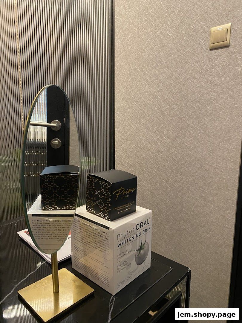 A display of skincare products, including a whitening drip, on a reflective surface.