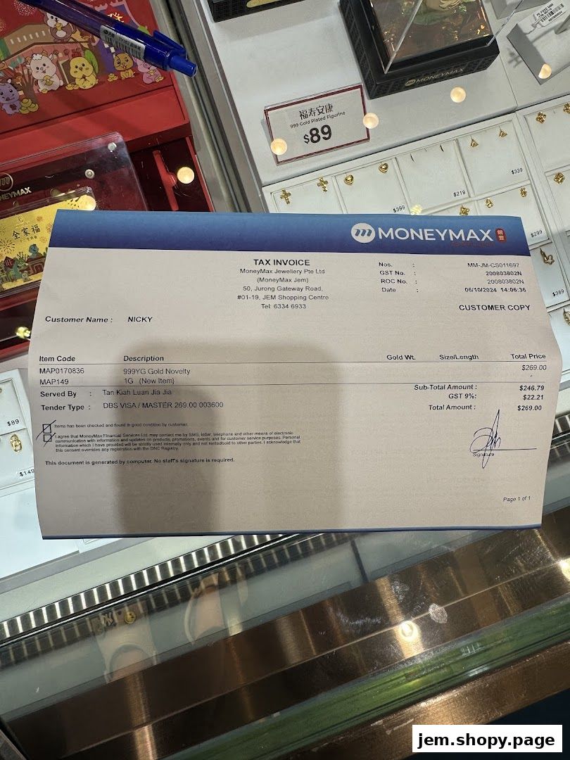 A tax invoice from MoneyMax Pawnshop - JEM for a gold novelty item.