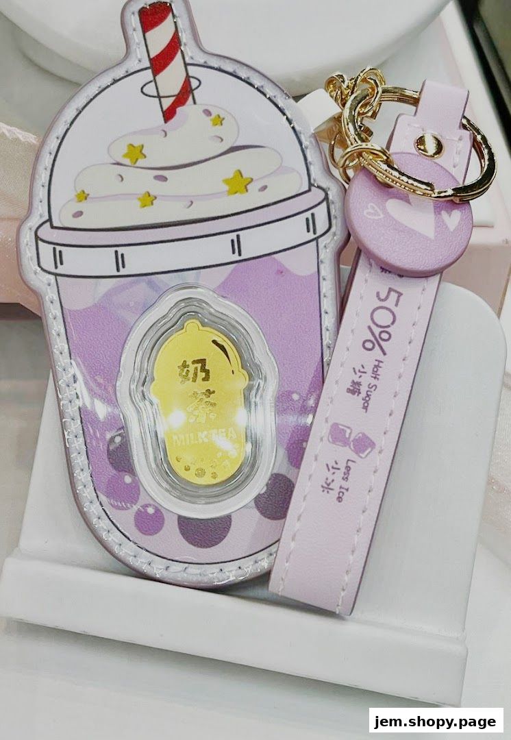 A cute milk tea themed keychain with a gold charm inside.