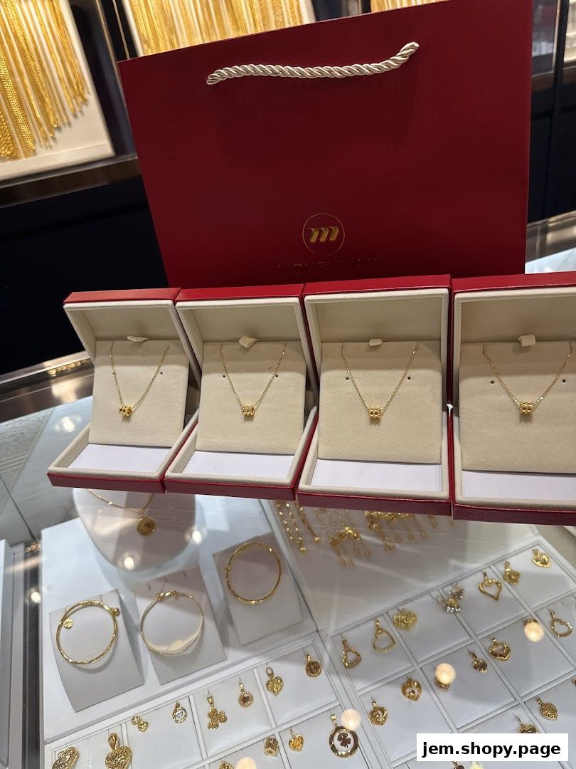 Display of gold necklaces and bracelets in a jewelry store.