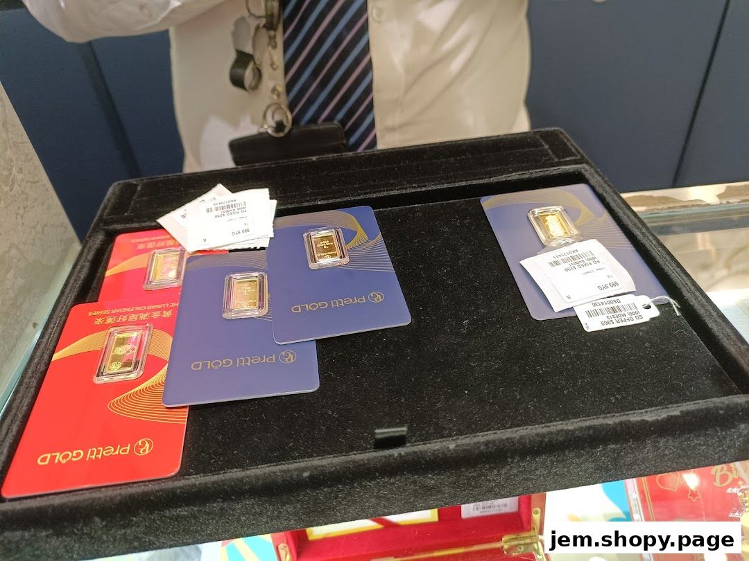 Gold bars displayed in a tray at MoneyMax Pawnshop.