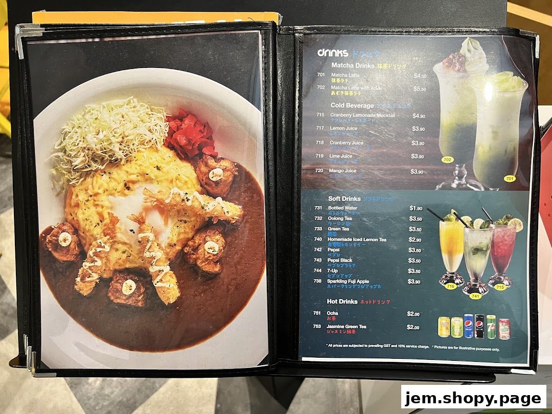 A menu open to a page showing a curry dish and a page with various drinks.