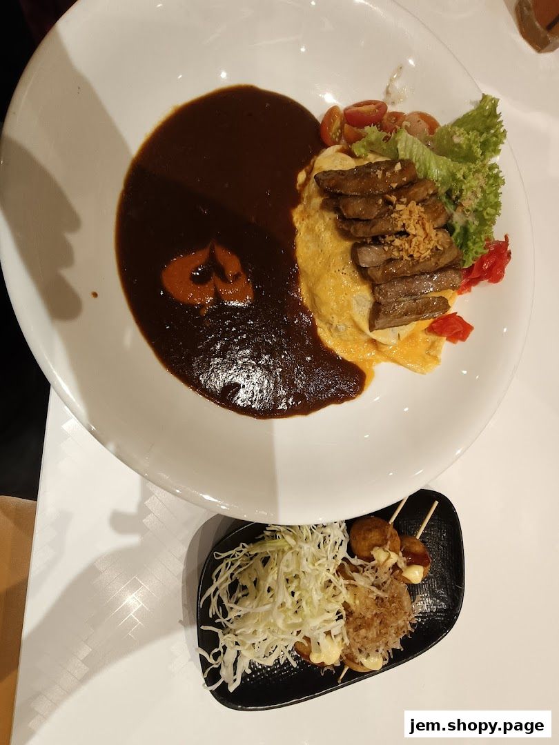 A delicious meal featuring omurice with steak and a side of takoyaki.
