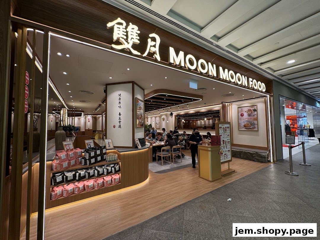 The exterior of Moon Moon Food restaurant with its signage and display of packaged goods.
