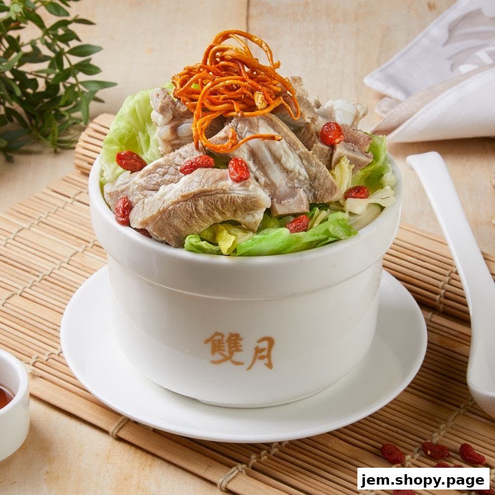 A bowl of pork ribs soup with lettuce, goji berries, and crispy noodles.