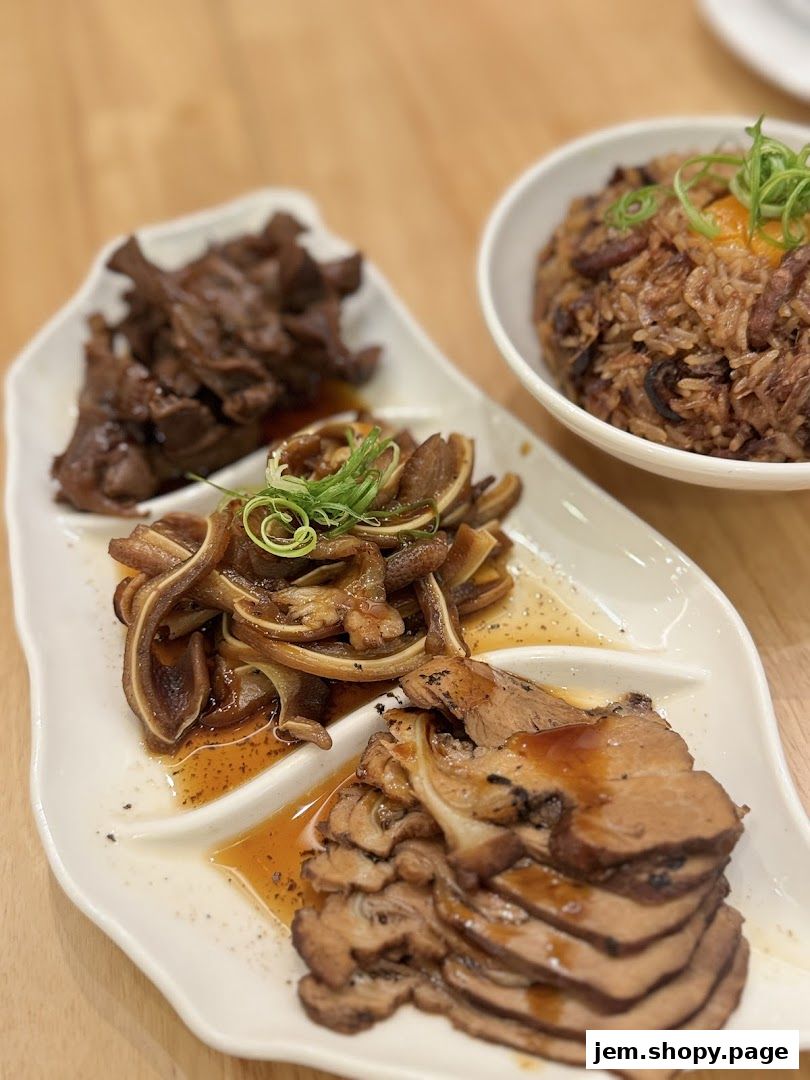 A platter of assorted braised meats and a bowl of savory rice.