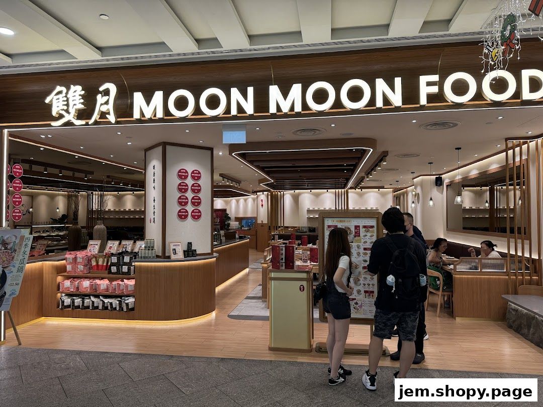 The exterior of Moon Moon Food, a restaurant with a modern wooden facade and illuminated signage.
